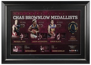 Brisbane Lions / Fitzroy FC signed Brownlow official print with replica Brownlow Medal. Limited edition #10 of 200. Signed by Kevin Murray, Bernie Quinlan, Michael Voss, Jason Akermanis and Simon Black. Official AFLPA CoA included. ​​​​​​​59 x 84cm overal