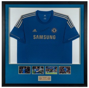 CHELSEA FOOTBALL CLUB: Frank Lampard signed Chelsea FC jersey (champions league season), framed with 4 action photos and plaque. With ASM Certificate of Authenticity. Overall 107 x 109cm.