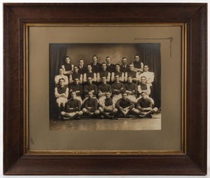 PRAHRAN A.J.M. (JAM FACTORY), 1917 Premiers, black and white team photograph in original oak frame with gilt slip and glass, ​​​​​​​with pencil inscription verso, sheet size 31 x 40cm, 60 x 70cm overall