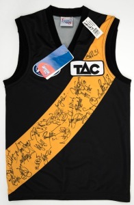 RICHMOND FOOTBALL CLUB: An official club jumper (short sleeves) signed by numerous players on the 2000 Richmond List. Accompanied by a letter from Richmond signed by Dale Weightman. The signed jumper was donated to the Port Melbourne Football Team for ass