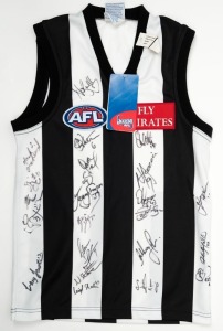 COLLINGWOOD FOOTBALL CLUB: An official club jumper (short sleeves) signed by numerous players on the 2000Collingwood List. Accompanied by a letter from Collingwood signed by David King. The signed jumper was donated to the Port Melbourne Football Team for