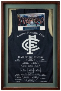 CARLTON FOOTBALL CLUB TEAM OF THE CENTURY commemorative jumper, attractively framed, overall 82 x 55cm. The Team of the 20th Century was announced at a special dinner on 20th May 2000.