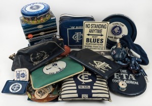 A collection of Carlton cushions or pillows, ties, a plastic carry bag, a night cap, a money box, a small football, various lanyards, a roll of Footy ribbon, some ashtrays, trays, coasters, and souvenir biscuit tins. (40+ items).