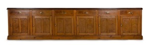 An impressive antique Colonial Australian shop fitting sideboard, Baltic pine with eucalypt top, South Australian origin, circa 1865, 93cm high, 401cm wide, 53cm deep