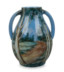 NEWTONE POTTERY two handled blue vase with hand-painted garden scene by DAISY MERTON, factory mark to base, 15cm high