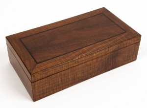 An antique Australian fiddleback blackwood jewellery casket with ebony string inlay and cedar secondary timbers, interior lined with original blue velvet, early 20th century, ​​​​​​​7cm high, 25.5cm wide, 13.5cm deep