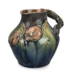 REMUED rare pottery jug with applied pomegranates and leaves, incised "Remued", 18cm high, 22cm wide