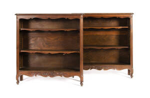 A pair of French carved oak free standing bookcases with cabriole legs, 20th century. Height 105cm, width 101cm, depth 28cm