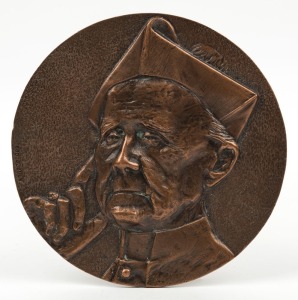 ARCHBISHOP MANNIX circular bronze plaque, signed ROD DUDLEY, 15.5cm diameter