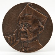 ARCHBISHOP MANNIX circular bronze plaque, signed ROD DUDLEY, 15.5cm diameter