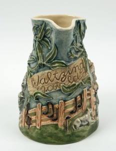 WALTZING MATILDA pottery jug with musical movement, 19.5cm high