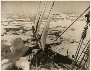 THE B.A.N.Z. ANTARCTIC EXPEDITION:Official original photograph by Captain Frank Hurley:Image B1 - Title: The Discovery heading through ice-congested waters of the Mackenzie Sea,with official "MAWSON ANTARCTIC EXPEDITION" handstamp and release date "MONDAY