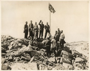 THE B.A.N.Z. ANTARCTIC EXPEDITION:Official original photograph by Captain Frank Hurley:Image B6 - Title: Raising the Flag over new Antarctica Territory,with official "MAWSON ANTARCTIC EXPEDITION" handstamp and release date "MONDAY APR. 13, 1931" verso, to