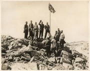 THE B.A.N.Z. ANTARCTIC EXPEDITION:Official original photograph by Captain Frank Hurley:Image B6 - Title: Raising the Flag over new Antarctica Territory,with official "MAWSON ANTARCTIC EXPEDITION" handstamp and release date "MONDAY APR. 13, 1931" verso, to