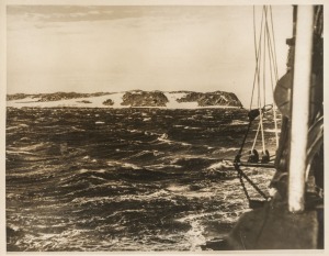 THE B.A.N.Z. ANTARCTIC EXPEDITION:Official original photograph by Captain Frank Hurley:Image B28 - Title: The Windiest Spot on Earth,with official "MAWSON ANTARCTIC EXPEDITION" handstamp and release date "TUESDAY JUN. 2, 1931" verso, together with the off