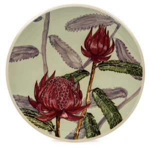 GUY BOYD Waratah hand-painted pottery wall plaque, incised "Guy Boyd, Australia", ​​​​​​​23.5cm diameter