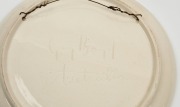 GUY BOYD two hand-painted pottery wall plaques with wildflower decoration on pink and green grounds, incised "Guy Boyd, Australia", ​​​​​​​24cm and 15cm diameter - 2