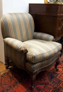 A pair of carved timber framed armchairs with blue & beige striped upholstery, late 20th century.