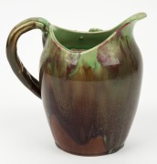 REMUED pottery jug with applied gum leaves and branch handle, glazed in green and brown with a blush of pink, incised "Remued", 17.5cm high - 3