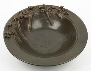 Studio pottery bowl decorated with applied gumnuts and leaves, glazed in dark green 14cm high, 44.5cm diameter