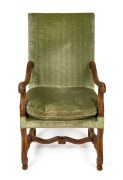 An antique French carved walnut armchair with green velvet upholstery, 118cm high x 65cm wide x 69cm deep&nbsp;