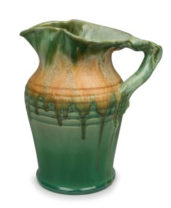 REMUED green glazed pottery jug with branch handle, incised "Remued 54L", 26cm high