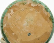 REMUED green and cream glazed pottery jug with branch handle,&nbsp; incised "Remued 173L",&nbsp; 10cm high, 18cm wide - 5