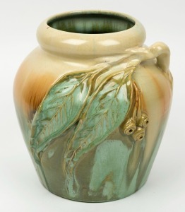 REMUED green and cream glazed pottery vase with applied gumnuts and leaves, incised "Remued 42/LM", 21cm high