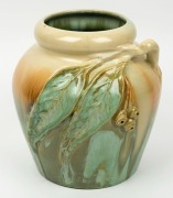 REMUED&nbsp;green and cream glazed pottery vase with applied gumnuts and leaves, incised "Remued 42/LM", 21cm high&nbsp;