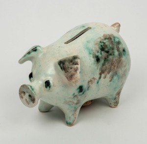 Pottery piggy bank with green mottled glaze,  11cm high, 16cm long 