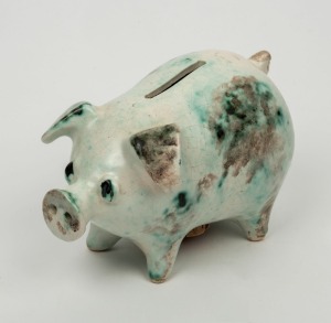 Pottery piggy bank with green mottled glaze, 11cm high, 16cm long