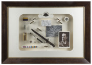 An ALBERT JACKA, VC TRIBUTE An attractively mounted and framed display of army badges, ribbons and buttons combined with battlefield finds - bullet cases, a bayonet, trench art and a 9ct gold and pearl "MOTHER/A.I.F." boomerang brooch, together with a pho - 3