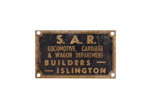 South Australia: &ldquo;S.A.R. LOCOMOTOTIVE, CARRIAGE & WAGON DEPARTMENT. BUILDERS - - ISLINGTON&rdquo;. Raw metal on black background, 4.5 x 7.5cm. Good condition.