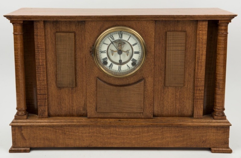 An Australian fiddleback blackwood and maple cased antique clock, Ansonia time and strike movement with open escapement and Roman numerals, 19th/20th century, ​​​​​​​34cm high, 54cm wide