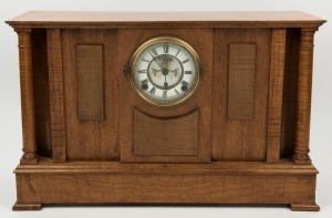 An Australian fiddleback blackwood and maple cased antique clock, Ansonia time and strike movement with open escapement and Roman numerals, 19th/20th century, 34cm high, 54cm wide