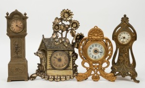 Four assorted American cast metal cased table clocks, all timepiece only, circa 1900, the largest 28cm high
