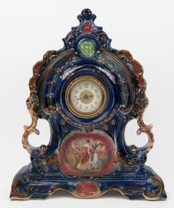 An antique German porcelain cased mantle clock, time piece only, early 20th century, 45cm high