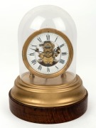 EUREKA CLOCK Co. Ltd of London (Pat. No.141614-1906) electric balance wheel clock in glass dome, early 20th century, ​​​​​​​32cm high