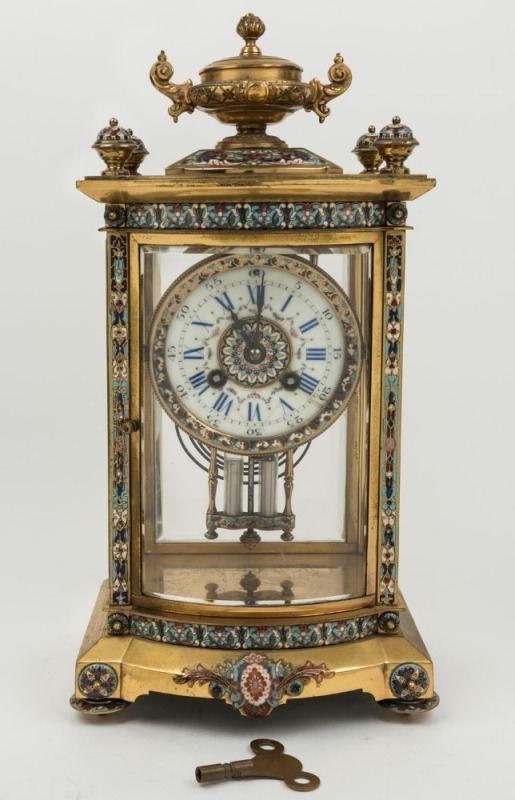 A fine quality antique French bow fronted four glass mantle clock in ormolu case with champlevé
