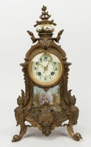 An antique French Rococo style clock in cast bronze case with Sevres style porcelain panel and ornamentation, with eight day time and gong striking movement by MARTI, 19th/20th century, 40cm high