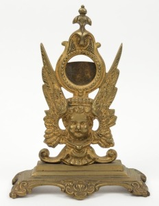 An antique cast metal pocket watch stand with gilt finish, 19th century, ​​​​​​​25cm high