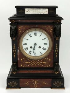 A fine antique French mantle clock in Belgium black slate and rouge marble case with incised and gilt decoration and bronzed mounts, eight day time and bell striking movement with Roman numerals, 19th century. bearing silver presentation plaque "KERANG DISTRICT AGRICULTURAL SOCIETY. 1st PRIZE FINE DAIRY COWS, Awarded To R.d AVARD. Esq. Sept. 14th, 1892", 37cm high