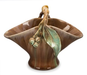 REMUED green and brown glazed basket vase with applied gumnuts and leaf with branch handle,  incised "Remued 194/10M", 20cm high x 26cm wide