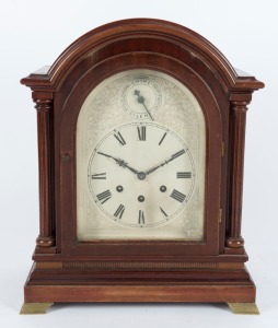 GUSTAV BECKER antique German mantle clock in mahogany case with break arch top and full length pillars, eight day quarter chiming three train movement with chime/silent subsidiary dial and Roman numerals on silvered dial, early 20th century, bearing presentation plaque on reverse, dated 1914. 40cm high