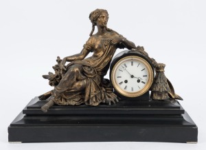 An antique French figural mantle clock in black slate and spelter case, time and strike movement and Roman numerals, 19th century, ​​​​​​​37cm high, 52cm wide