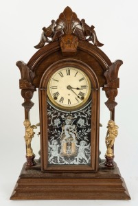 ANSONIA antique American timber cased mantle clock with figural decoration, eight day time and strike movement with Roman numerals, 19th century, 55.5cm high