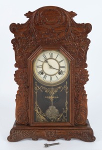 WATERBURY antique American cottage clock with pressed oak case, eight day time and strike movement with Roman numerals, 19th century, 56cm high