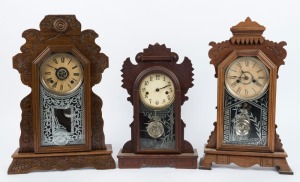 Three antique American mantle clocks in timber cases, including WATERBURY and ANSONIA, 19th century, the largest 54cm high