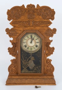 WELCH antique American cottage clock in pressed oak case with eight day time and gong striking movement, 19th century, ​​​​​​​61cm high
