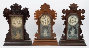 Three antique American cottage clocks in timber cases by ANSONIA and WATERBURY, 19th century, the largest 58cm high